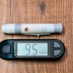 Blood glucose meter showing a normal reading