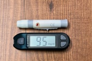 Blood glucose meter showing a normal reading